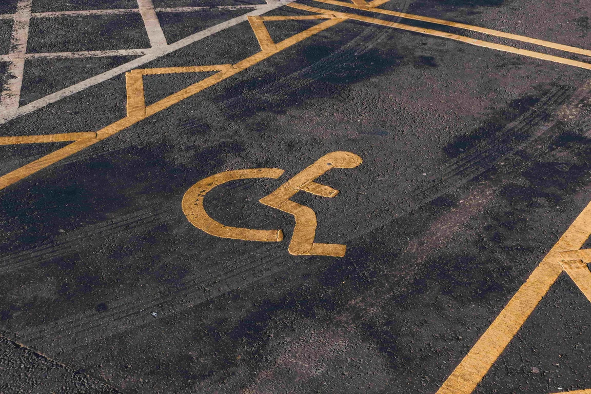 disabled sign painted on a car parking space