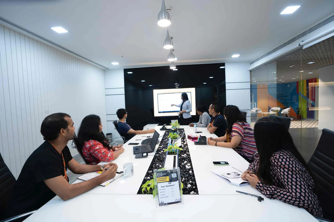 a group of people around a meeting table